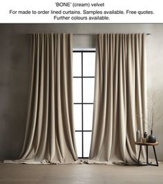 the curtains are open and ready to be hung in front of an open window with a vase