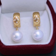 Get ready to feel like a classic style icon with House of Pearls 11-12mm freshwater pearl & vintage gold earrings. These gorgeous earrings are perfect for special occasions and everyday wear alike, with a timeless design that adds an air of elegance to any outfit. Make sure your jewelry box is stocked with these timeless classics — you’ll never go wrong pairing these earrings with anything from a business casual look to a formal ballgown. White 11-12mm Freshwater Pearl Earrings This popular earr Luxury Pearl Pendant Earrings, Elegant Yellow Gold Jewelry With Classic Design, Elegant Yellow Gold Classic Jewelry, Elegant Classic Yellow Gold Jewelry, Luxury Akoya Pearl Drop Earrings, Luxury Round Pearl Drop Earrings, Refined Round Pearl Earrings As Gift, Refined Round Pearl Earrings For Gift, Refined Yellow Gold Pearl Earrings For Anniversary