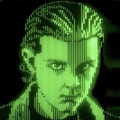 an image of a man with green lights on his face and head in the background