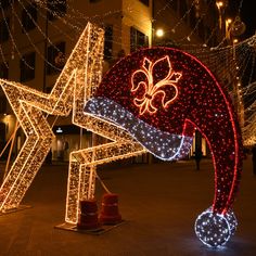 christmas lights and decorations are displayed on the street