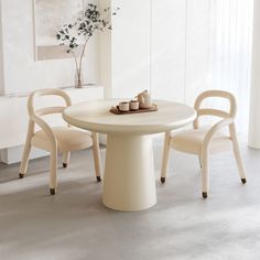 a white table and chairs in a room