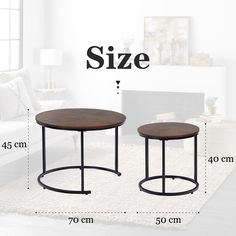 two tables sitting on top of a rug next to a couch