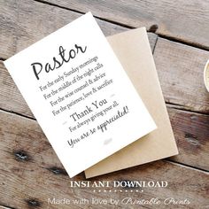 a cup of coffee sitting next to a card on top of a wooden table with the words pastor