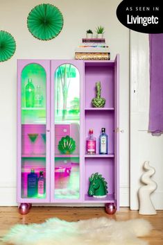 a purple and green display cabinet in a room