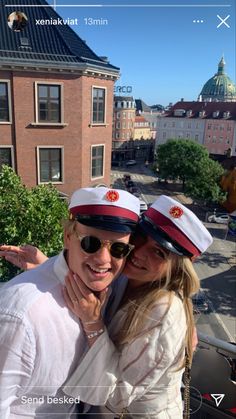 two women are posing for the camera with their arms around each other while wearing hats