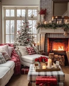 a living room filled with furniture and a fire place next to a christmas decorated tree