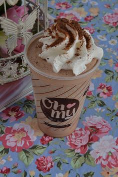 there is a drink with whipped cream on top and chocolate shavings in the foam