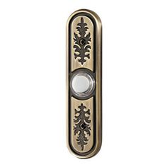 an antique style door handle with decorative designs on the front and back panel, in bronze