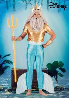 a man dressed as the little mermaid holding a gold spear