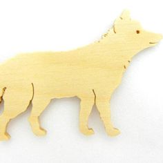 a wooden cutout of a dog on a white background