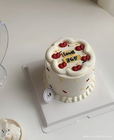 a white cake sitting on top of a table