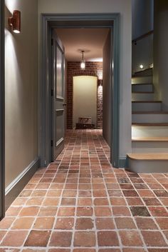 an empty hallway with stairs leading up to the second floor