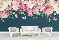 a living room with flowers and butterflies on the wall