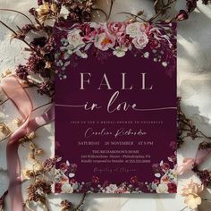 a purple and pink wedding card with flowers on it