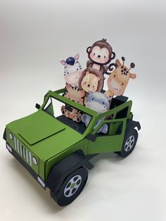 a green toy car with animals in the back