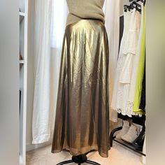 Aritzia Wilfred Liquid Gold Midi Skirt Size 6 Lined Back Zipper And Hook Closure Excellent Condition! Never Worn Too Big For Me. Waist Is About 13” Laying Flat Gold Fitted Midi Skirt, Metallic Lined Skirt For Summer, Metallic Lined Flared Skirt, Chic Metallic Flowy Skirt, Chic Flowy Metallic Skirt, Chic Fitted Gold Maxi Skirt, Gold Long Skirt For Formal Occasions, Metallic Flared Skirt, Gold Relaxed Skirt Bottoms For Spring