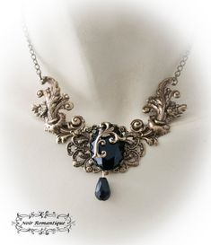 "♥♥Noir Romantique♥♥ Welcome to my store! \"Eternal beauty \"necklace A necklace comprised of 2 bronze rococo flourishes (42x22mm each) perfect detailed set on the left and right of bronze crown setting that is placed upon a central ornament in the middle and finally holds a get black gem 25x18mm. Flourish detail is attached to the gem. Black teardop bead is hanging. ------- If you need a specific lenght contact me :) ------------ ♥♥ The metal parts are of high quality brass ♥♥ Nickel and lead f