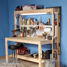 a workbench with lots of tools and supplies on the shelf next to it