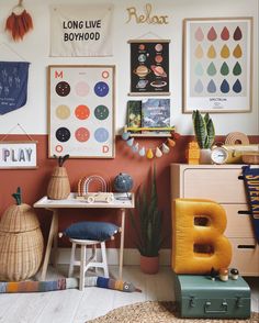 a child's playroom with toys and posters on the wall