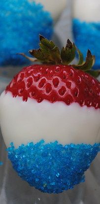 an image of a strawberry with green and white frosting on it's side