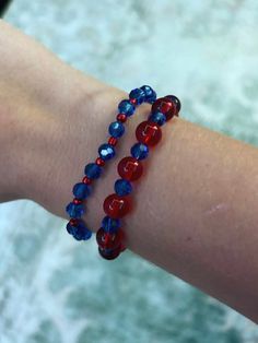 These red and blue bracelets are perfect for any occasion. Red And Blue Jewelry, Adjustable Red Beaded Bracelets For 4th Of July, Patriotic Red Adjustable Beaded Bracelet, Blue Stretch Bracelet For 4th Of July Gift, Blue Adjustable Stretch Bracelet For 4th Of July, Adjustable Blue Jewelry For 4th Of July, Blue Beaded Patriotic Stretch Bracelet, Red Round Beads Bracelets For 4th Of July, Red Bracelets For 4th Of July Gift