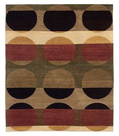 a multicolored rug with circles and stripes on the bottom in brown, black, red, green, yellow and beige colors