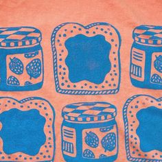 a t - shirt with blue images of jams and bread in jars on an orange background