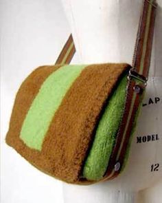 a handbag made out of felt and fabric with a zippered closure on the front