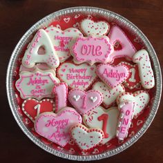 a bowl filled with lots of decorated cookies