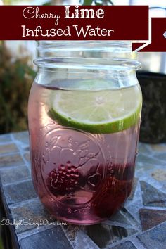 a mason jar filled with liquid and lime