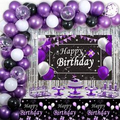 a birthday party with purple and white balloons