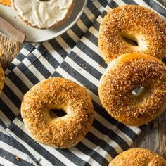 bagels with cream cheese frosting on a striped napkin