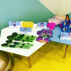 there are many items on the table for children to play with in the sandbox