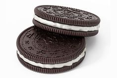 two oreo cookies are stacked on top of each other