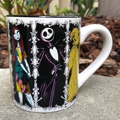 a coffee mug with the skeleton and jack skellingy characters on it