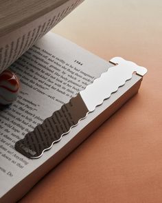 an open book with some paper cut out of it