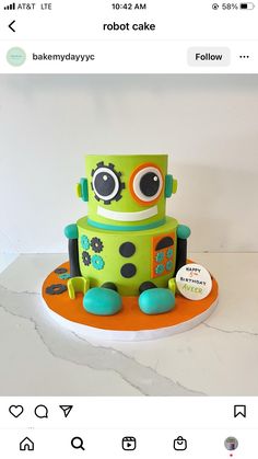 a green robot cake sitting on top of a table