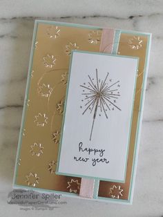 a handmade new year's card with a dandelion design on it