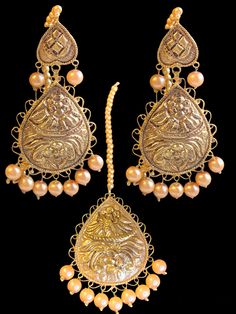 Ready to ship earrings tika  Very light weight yet high end quality  Gold plated  Shell pearls used Gold Tikka With Tilla As Gift, Gold Teardrop Jewelry Sets For Celebration, Gold Tikka With Latkans For Festive Occasions, Elegant Chandbali Tikka For Celebration, Festive Gold Tikka With Intricate Design, Festive Gold Tikka With Latkans, Elegant Tilla Pearl Earrings For Wedding, Gold Chandbali Tikka Gift, Gold Chandbali Tikka As A Gift