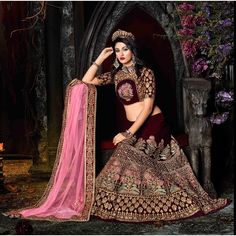 About Product: Dip yourself in the magic of this Wine Colored bridal lehenga made in Velvet. Highlighted with all-over themed thread and zari hand embroidery enriched with stone work embellishment. Also comes along with a Wine Colored velvet choli and a laced net dupatta, both embellished in similar work.  Lehenga Choli Fabric :  Lehenga Fabric:-  Georgette, Velvet, Soft Net  Blouse Fabric:- Georgette, Velvet, Soft Net  Dupatta Fabric:- Net  Work:- Embroidery, Thread Work Size: Semi Stitch Up to 42 Occasion:  Sangeet, Festive, Wedding Washing Instruction: Dry Wash Customize stitching: Please provide your complete size. We will stitch your outfit according to your size.  We will send you the measurement chart after order confirmation for the custom order. Disclaimer: Actual Color May Slight Maroon Bridal Lehenga, Bridesmaid Lehenga, Velvet Lehenga, Indian Bridal Lehenga, Pakistani Wedding Outfits, Lehenga Online, Pink Lehenga, Bridal Lehenga Choli, Velvet Blouses