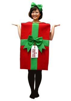 a woman wearing a red and green present box costume with her arms out in the air