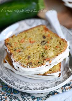 two slices of carrot cake are stacked on top of each other, with frosting