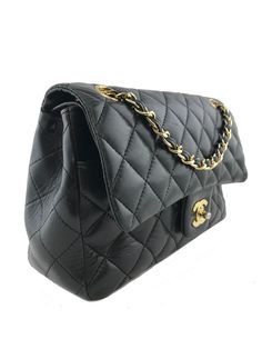 We  the ity of this chic and sophisticated vintage Chanel Quilted Lambskin Classic Medium Double Flap Bag crafted from Chanel's signature black diamond quilted leather and 24k gold plated hardware. This highly sought after bag features a chain link and leather strap that has the option of being  long over the shoulder or doubled. The frontal flap with signature 'CC' turn-lock closure opens to a burgundy leather interior with patch pockets.Condition: Very Good.  The exterior front and rear leather, although still gorgeous and clean throughout, has developed creasing and scuff markings, particularly on the rear top-edges of the bag and around the front flaps edges. The quilting is in remarkable condition and has kept its puffiness and still has a buttery-soft feel. The bottom edge corners ha Chanel Vintage Classic Double Flap Bag Quilted Lambskin Medium, Chanel Flap Bag, Shopping Chanel, Girl Backpacks, Diamond Quilt, Vintage Chanel, Quilted Leather, Exclusive Bag, Leather Chain