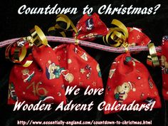 two red bags with gold bows tied to them and the words, we love wooden arbort calendars