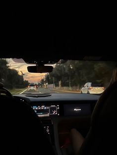 the view from inside a car driving down a road