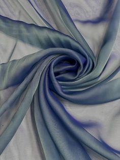 a blue and white fabric with wavy lines