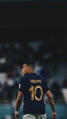 a man standing on top of a soccer field