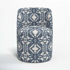 a blue and white patterned chair on a white background