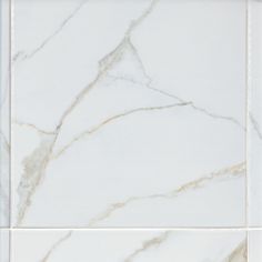 a white marble tile with gold veining