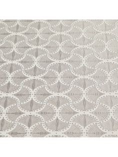 a white and gray rug with circles on it